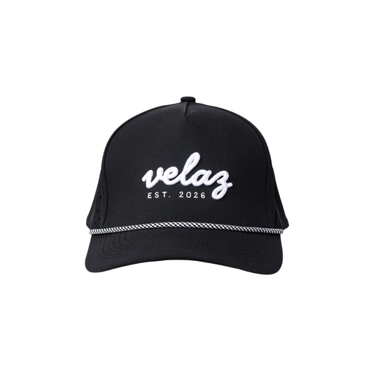 Gorra Velaz Padel Edition negra con logo bordado en blanco, accesorio para jugadores de pádel